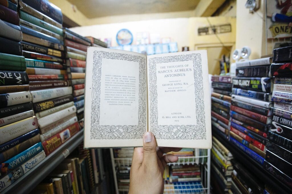 Photo by Denniz Futalan: https://www.pexels.com/photo/person-holding-open-vintage-book-4956953/