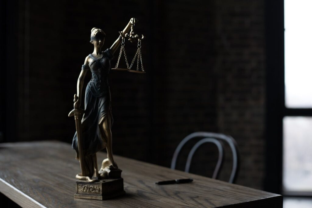 Photo by KATRIN BOLOVTSOVA: https://www.pexels.com/photo/a-figurine-of-the-lady-justice-on-a-table-6077297/